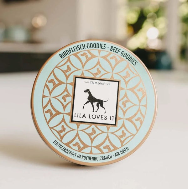 Lila Loves It beef goodie tin featuring a dog logo and decorative design.