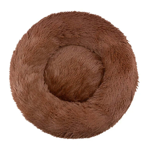 Round plush pet bed in warm brown color, perfect for small to large dogs and cats to sleep comfortably.